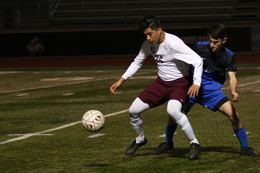 Senior varsity soccer player Jason Pardo (26) blocks the Byron Nelson player during the game on Friday, March 3.