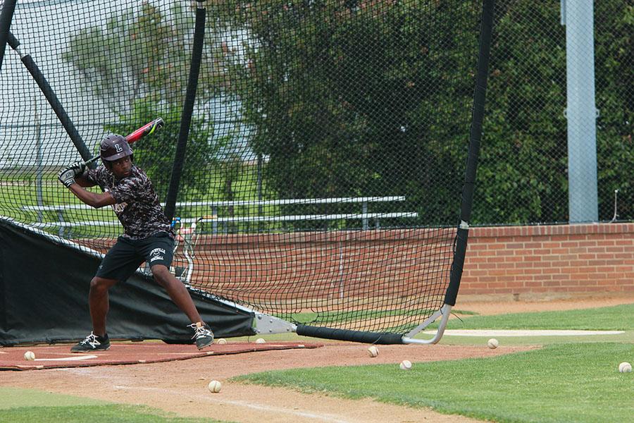 Senior+Patrick+Bethea+practices+batting+during+fourth+period+on+Tuesday%2C+April+25.