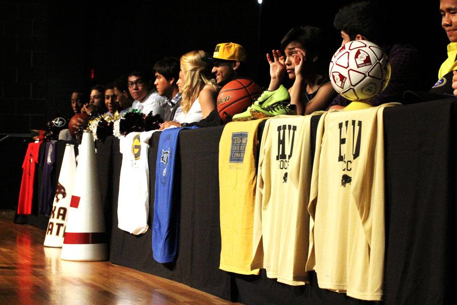Fifteen students wait to sign to their colleges on May 12.