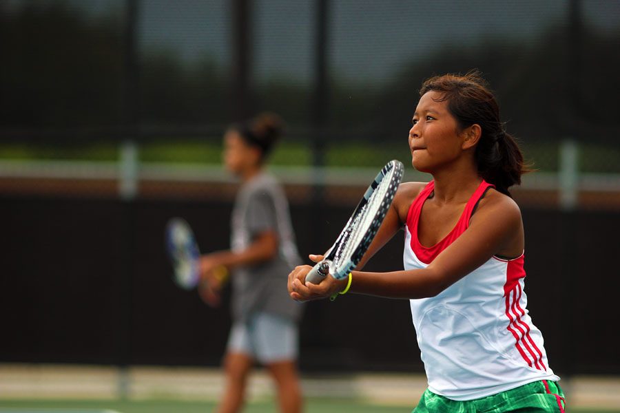 Sophomore Helen Sung watches the ball carefully before delivering a powerful blow to her opponent.