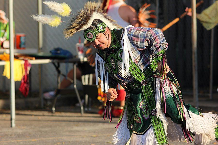 A member of the Tribal Traditions Dance Troupe performs his traditional dance.