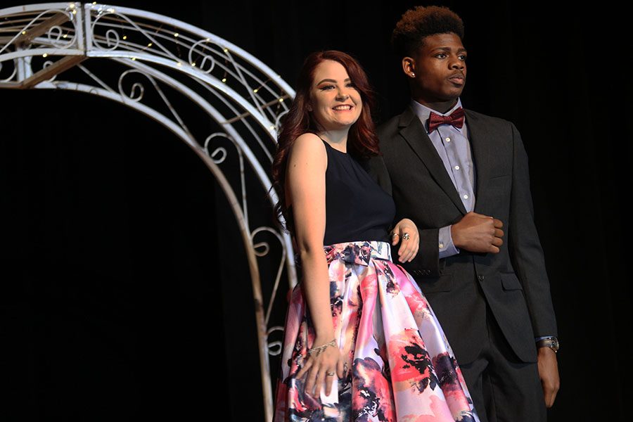 Seniors Avery Taylor and Cedrick Dockery stop to pose for an admiring crowd.