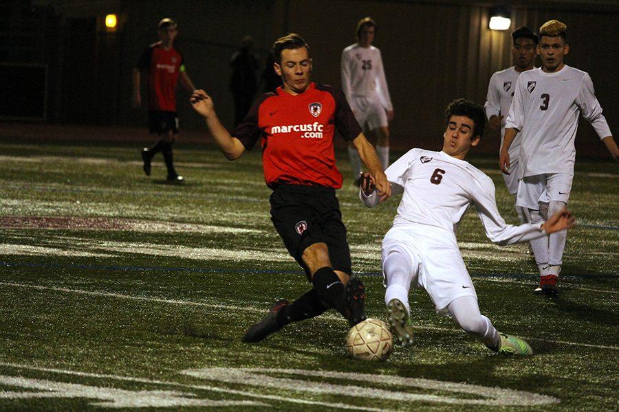 Junior Josue Romo (6) lunges in for the tackle.