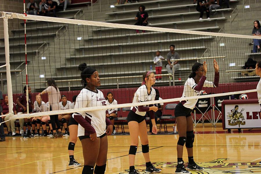 Senior+Ryleigh+Taylor+%2815%29%2C+senior+Rachel+Barnett+%286%29+and+junior+Isis+Williams+%2817%29+prepare+for+the+next+play+during+the+game+against+Southlake+on+Tuesday%2C+Sept.+19.