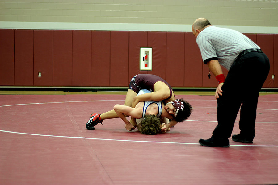 Sophomore+Vinny+Hill+pins+down+a+Flower+Mound+wrestler.