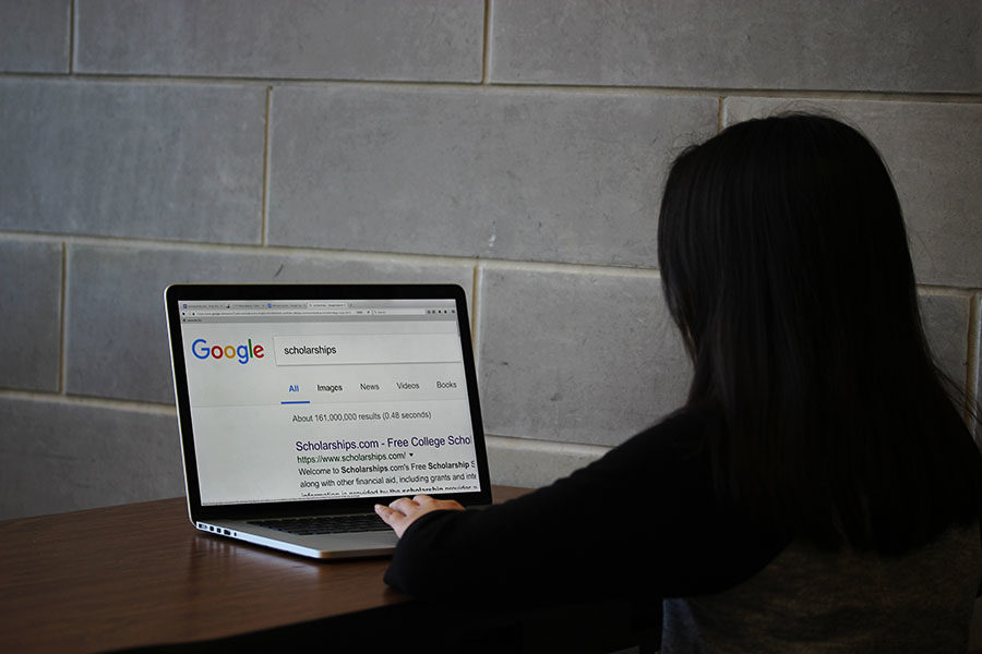 A+student+searches+for+scholarships+on+Google.