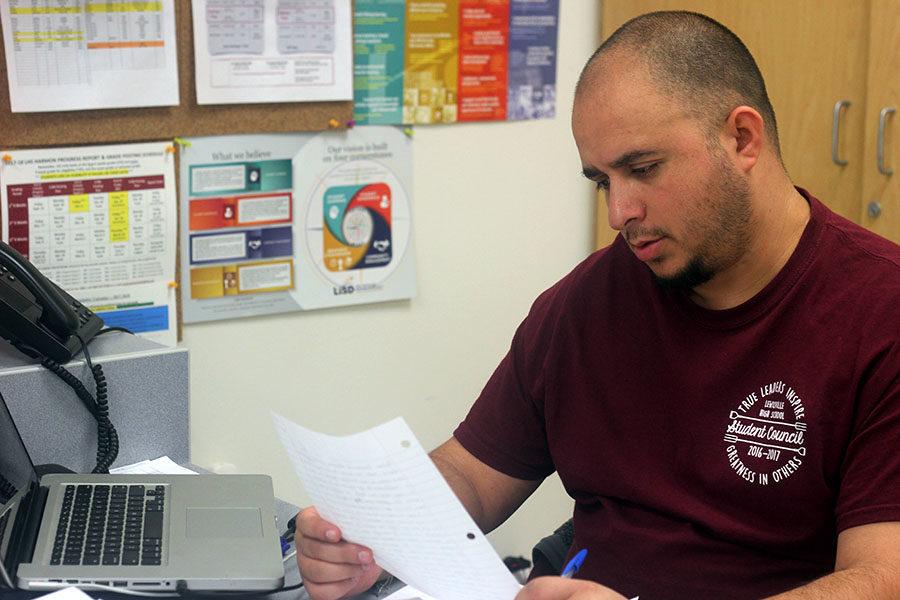 Spanish+Teacher+Jose+Dominguez+grades+papers+during+second+period+on+Friday%2C+Feb.+9.