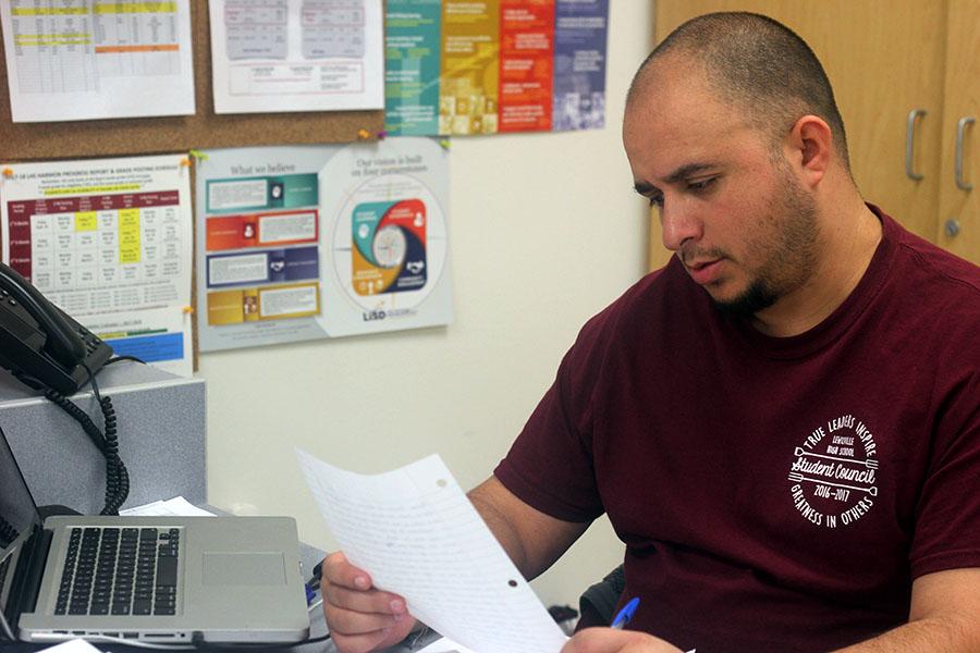 Spanish Teacher Jose Dominguez grades papers during second period on Friday, Feb. 9.