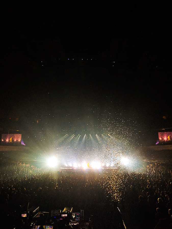 Star-shaped confetti falls onto the audience during the last song