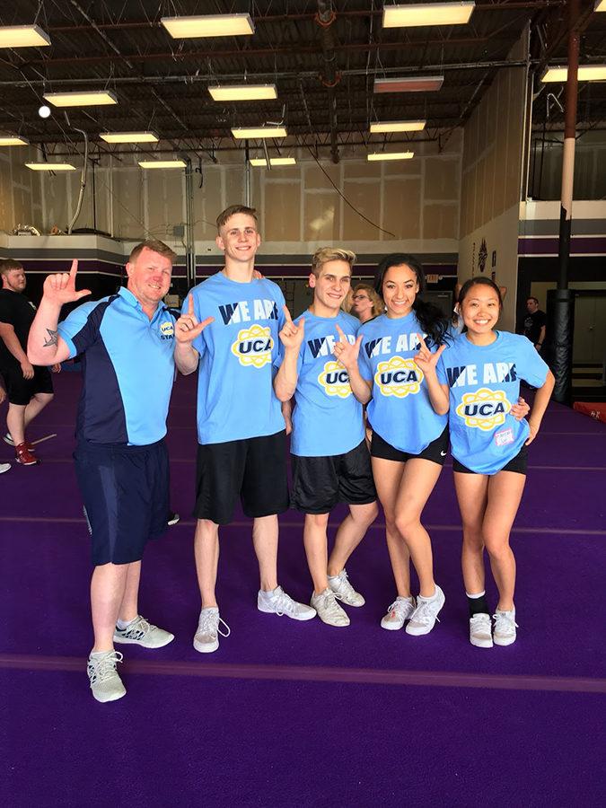 A+Universal+Cheerleading+Association+representative+and+seniors+%28left+to+right%29+Landyn+Gage%2C+Tyler+Carver%2C+Trinity+Kulow%2C+Hannah+Son+pose+after+being+selected.+Courtesy+of+Lewisville+Cheer.+