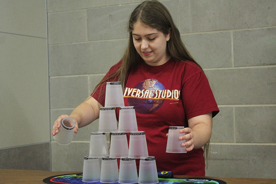 Senior+Sarah+Raptis+begins+to+stack+her+cups.
