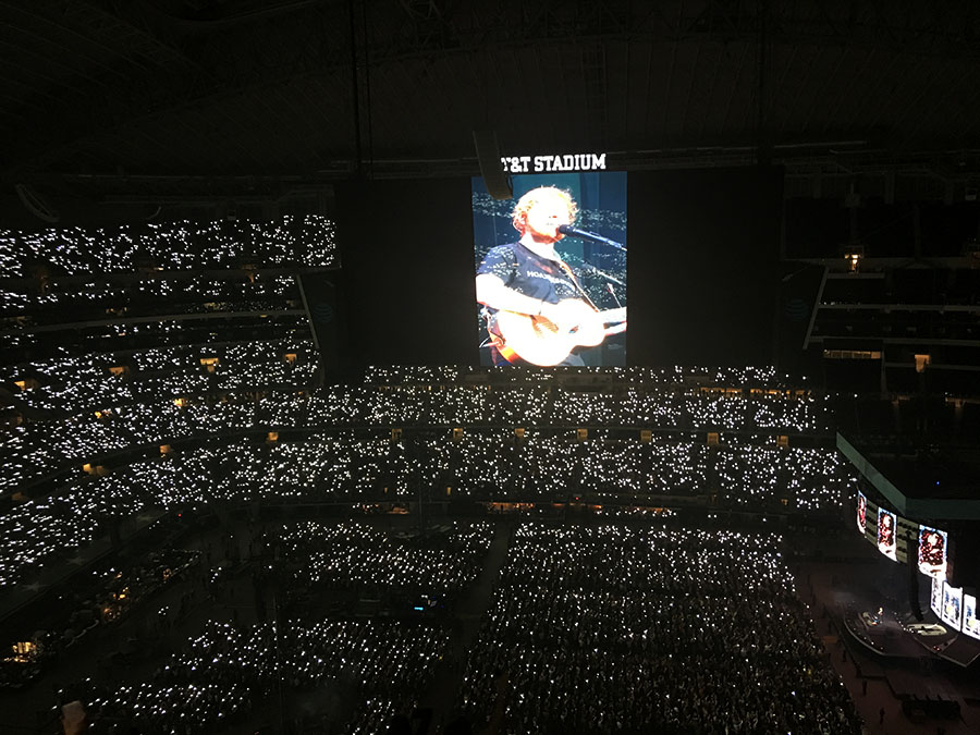 Fans hold up flashlights during Ed Sheeran's performance of