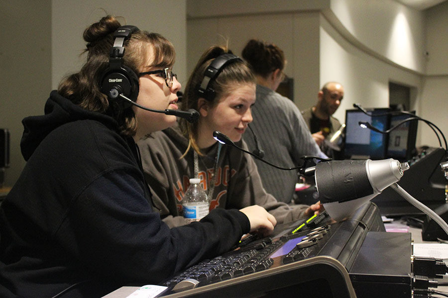 Juniors+Kaylie+Davis+and+Claire+Fowler+control+the+lightboard+during+rehearsal.