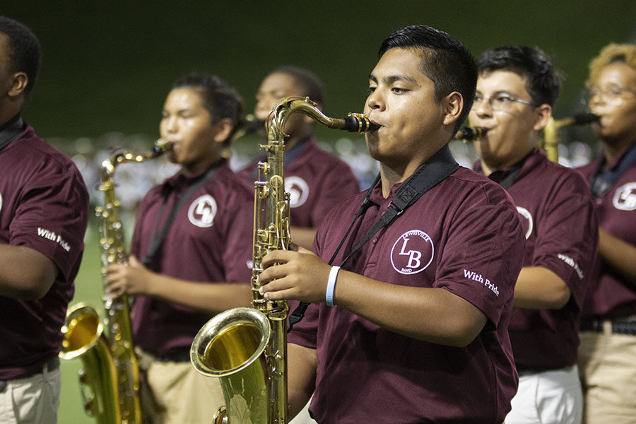 Senior+Isaac+Ramirez+performs+a+song+during+halftime+along+with+the+rest+of+the+saxophone+section+at+the+away+game+in+the+Grand+Prairie+stadium+on+Friday%2C+Aug.+31.
