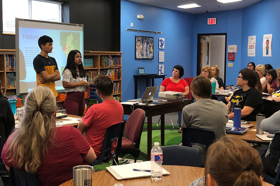 A captive audience listens to seniors Amos Nun Sung and Par Hniang explain Chin history. Courtesy of Adam Gray.
