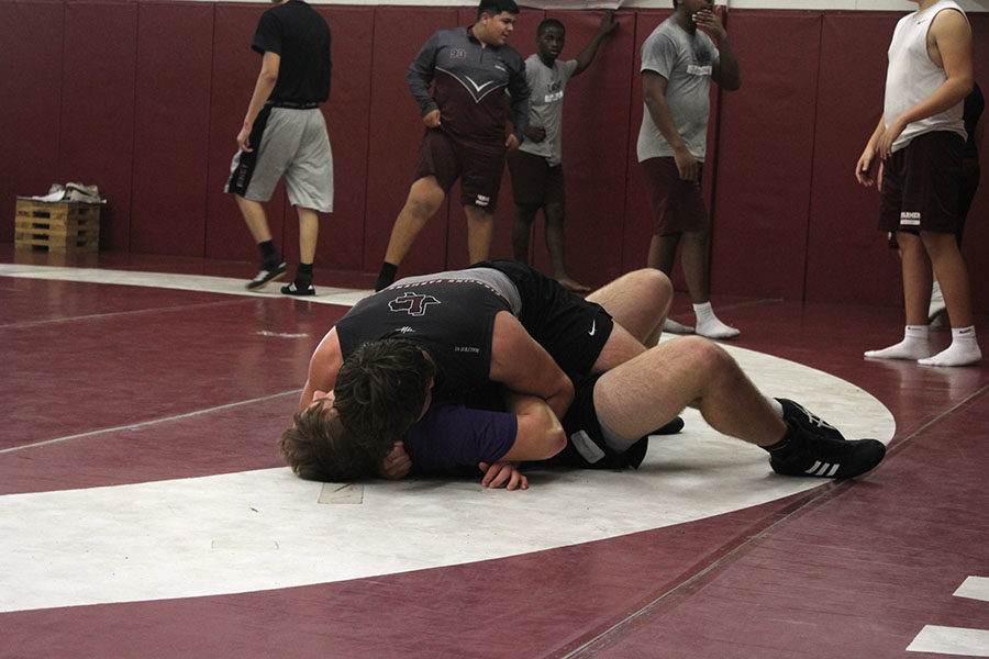 Juniors+Luke+Halter+and+Dylan+Adams+practice+in+the+wrestling+room+after+school+on+Monday%2C+Dec.+10.