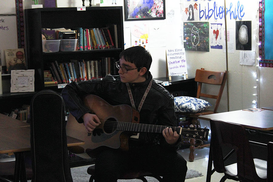 Guitar+club+president+senior+Dalton+Baham+practices+with+his+guitar+during+the+club+meeting+on+Wednesday%2C+Jan.+30.