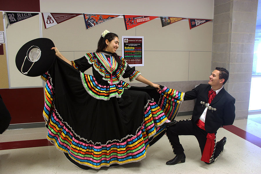 Senior+Anna+Martinez+looks+down+at+senior+David+Saravia+as+they+finish+dancing+during+practice+after+school+on+Tuesday%2C+Jan.+29.