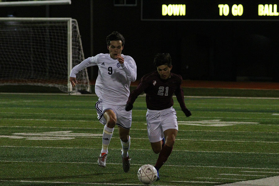 Junior+forward+Ethan+Carbajal+%2821%29+runs+after+the+ball+in+effort+to+regain+control+of+it.