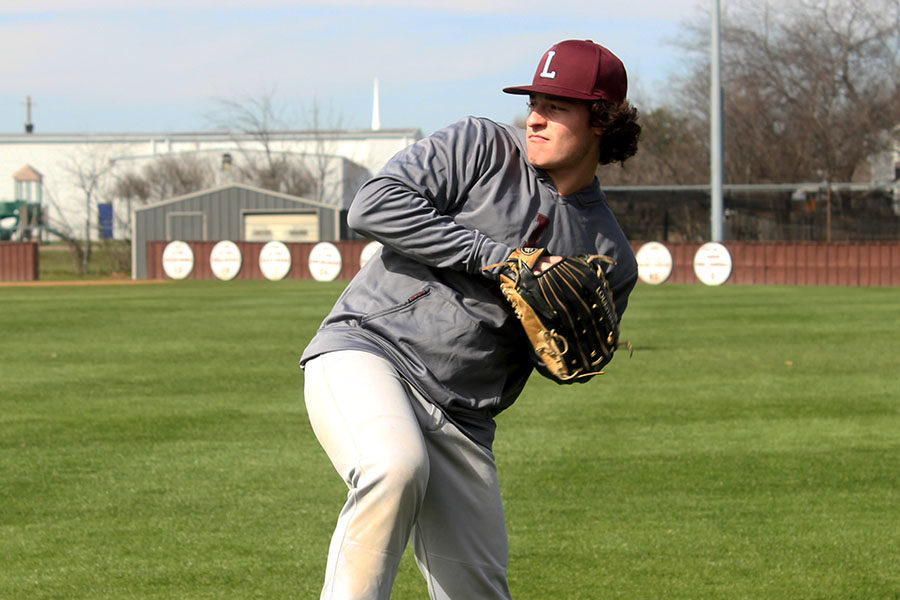 Senior+captain+Caleb+Vuono+practices+pitching+on+Wednesday%2C+March+6+during+fourth+period.+