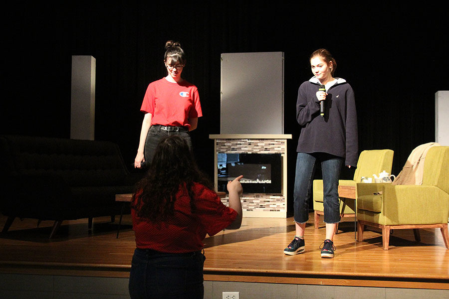 Senior+Avery+Brooks+helps+junior+Sophia+Cauduro+and+sophomore+Madelyn+Bloom+on+their+singing+during+%22What+is+this+feeling%3F%22+for+%22Wicked.%22