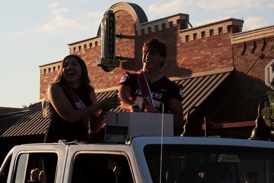 Senior+princess+Kayla+Rios+and+senior+prince+Luke+Halter+ride+in+the+homecoming+parade+together+on+Wednesday%2C+Oct.+2.