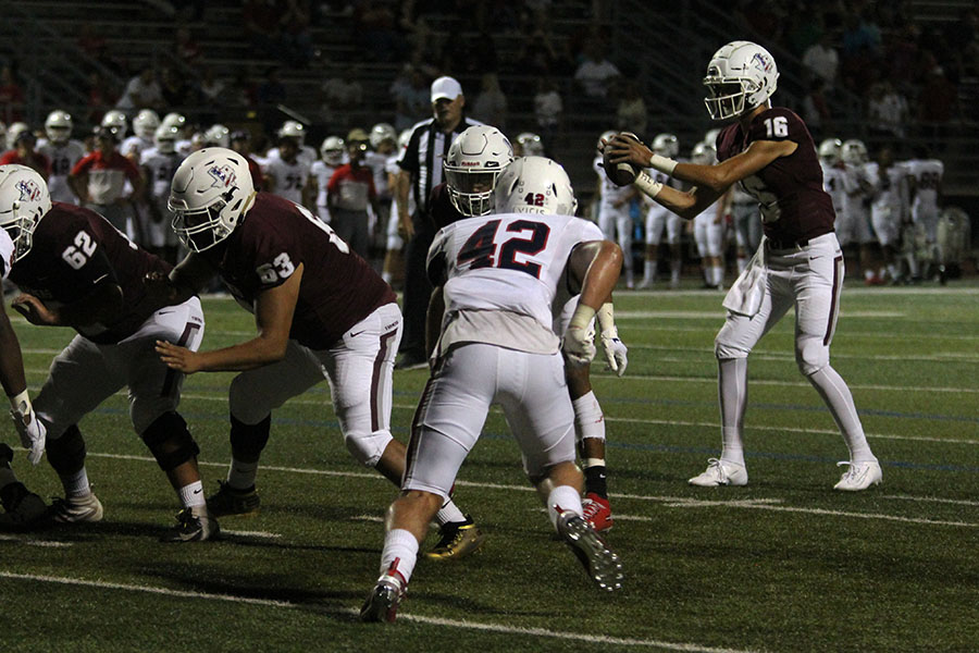 At+the+beginning+of+a+play%2C+junior+quarterback+Landon+Webster+%2816%29+prepares+to+throw+the+ball+at+a+home+game+against+McKinney+Boyd+on+Friday%2C+Sept.+13.+