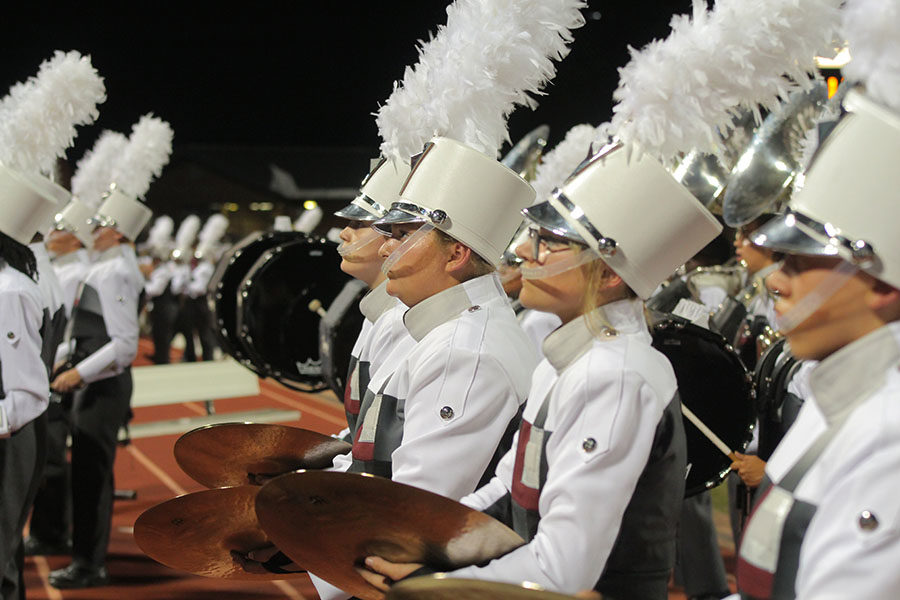 The+cymbal+line+walks+off+the+field+in+the+band%27s+%22LHS%22+formation+after+the+halftime+show+at+the+away+game+against+Flower+Mound+on+Friday%2C+Sept.+27.
