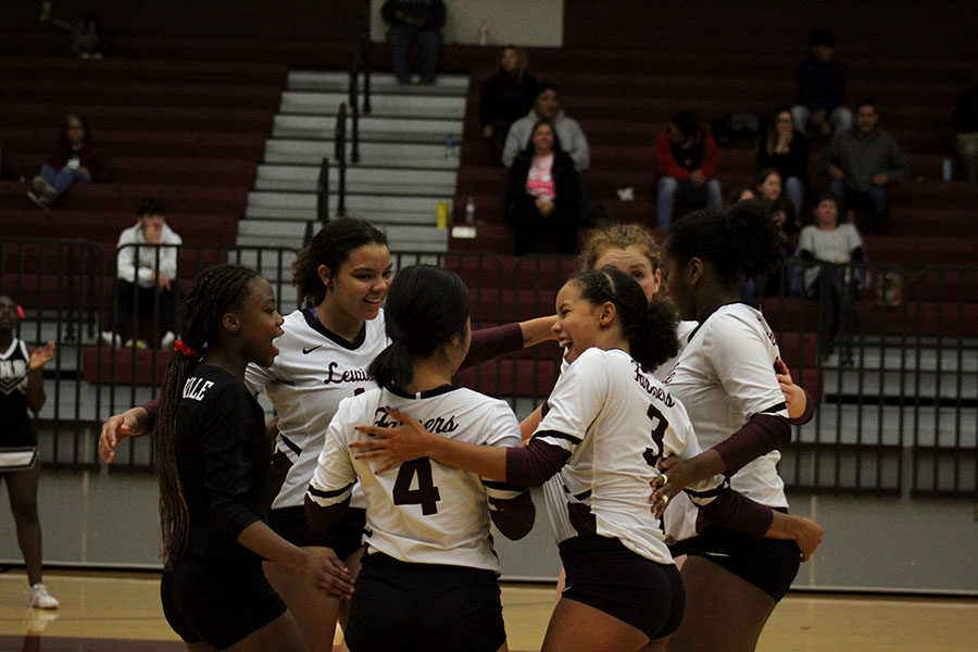 The team celebrates a point scored, bringing the overall score to 22-15, with Nimitz in the lead.